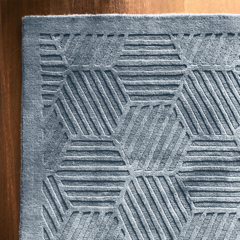 Carved silver grey rug